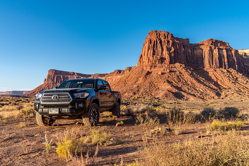 A Black 2017 Toyota Tacoma explores around the backroads near Canyonlands National Park Utah.