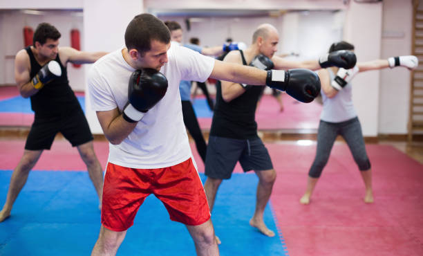 istock Group of athletic people of different ages training 1190430015