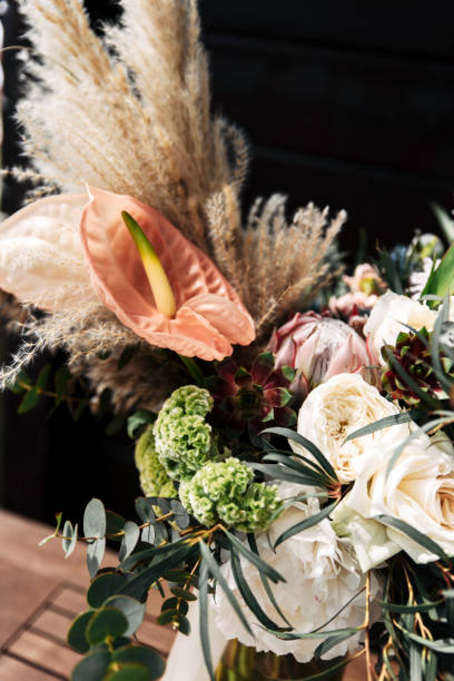 istock Bridal bouquet with calla lilies and peonies in boho style 1190430164