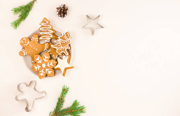 istock Gingerbread gingerbread on a plate on a light background, Christmas tree branch, cone. The concept of food for Christmas. 1190430983