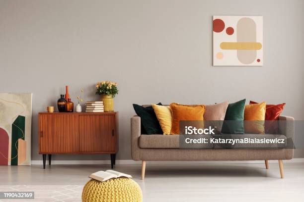 Retro Style In Beautiful Living Room Interior With Grey Empty Wall Stock Photo - Download Image Now