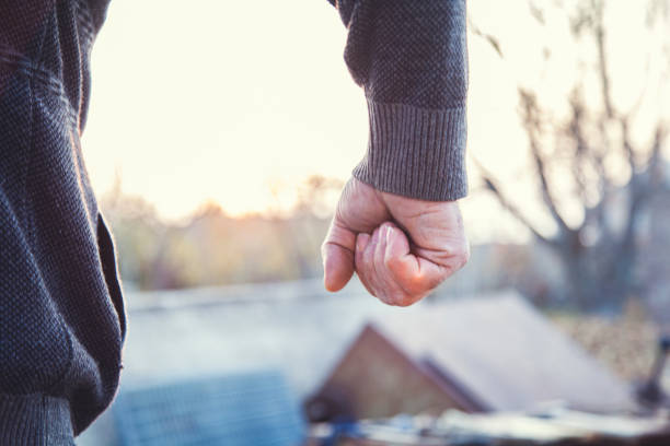 istock man hand fist in nature 1190432396