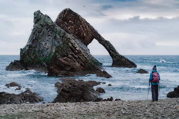 Photo of Woman at Bow Fiddle Rock, Portknockie, Scotland