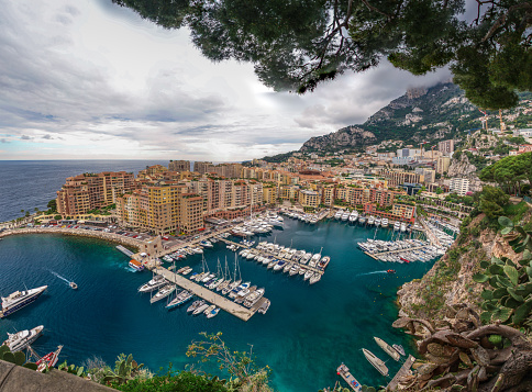 Principality of Monaco. Beautiful panoramic view on Monaco, Monte-Carlo golden hour scenery. View on apartment building, casino, great port with luxury yachts. Monaco is popular travel destination.