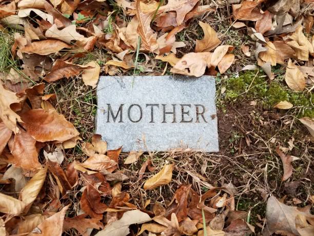 Mourning statue of Mother and child - old cemetery at Krasna Lipa, Czech republic, Europe