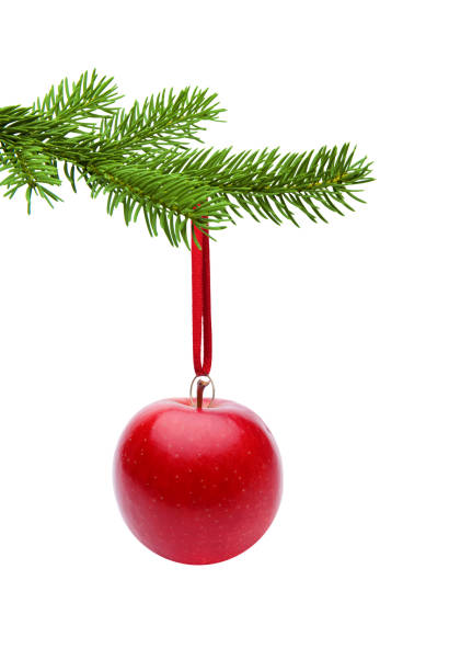 istock Red Apple hanging at a Christmas Tree cut out 1190435112