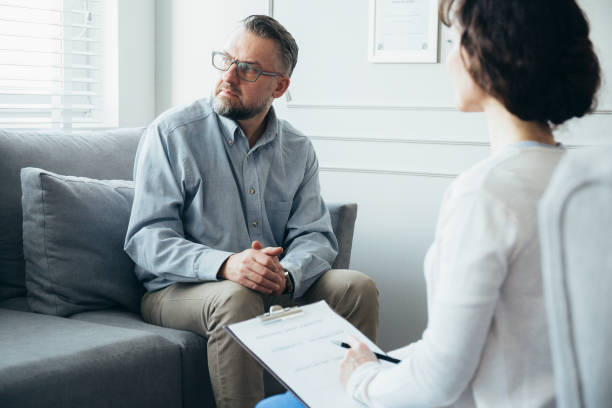 istock Psychotherapist working with man in office 1190436569