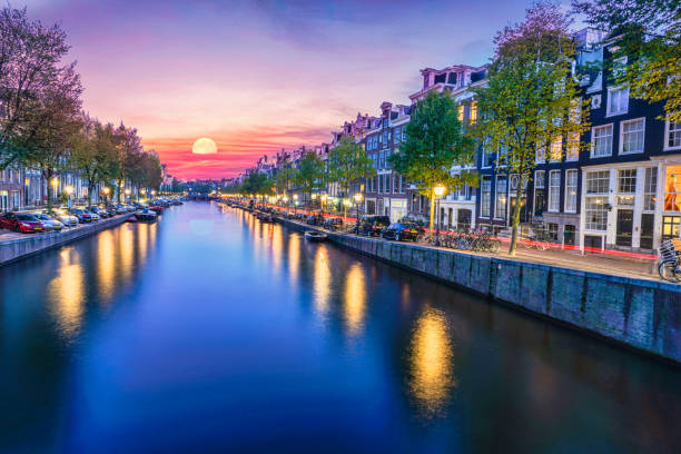 istock Amsterdam canal side dutch architecture at night 1190438779