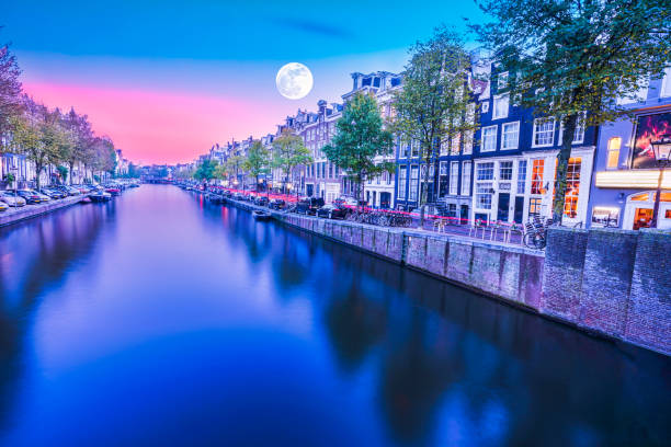 istock Amsterdam canal side dutch architecture at night 1190438788