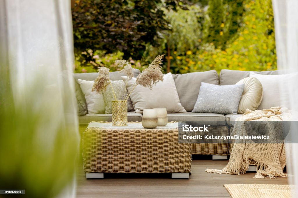 Cozy terrace Cozy decor of a big wooden terrace in a modern villa Furniture Stock Photo