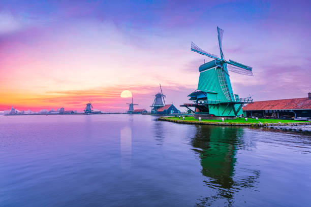 istock Dutch countryside with windmills at sunset twilight 1190439033