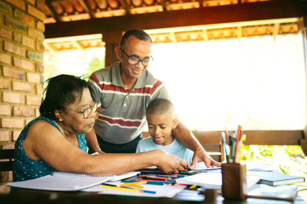 istock Grandparents helping grandson with homework on the deck 1190439300