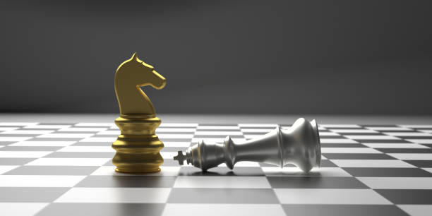 istock Chess knight gold standing winner on chessboard background. 3d illustration 1190439511