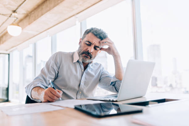 istock Worried businessman at the office 1190440371