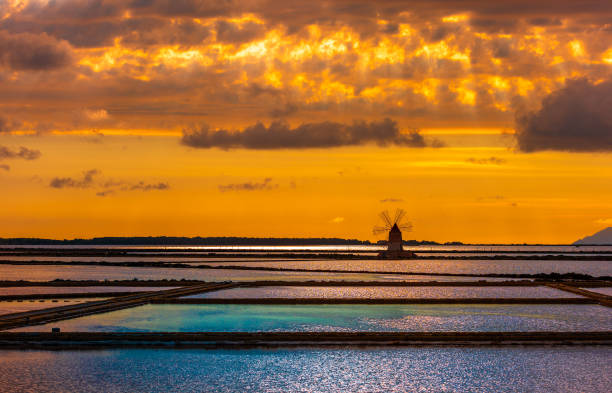 Marsala salt pans at sunset, Sicily, Italy Marsala salt pans at sunset, Sicily, Italy salt flat stock pictures, royalty-free photos & images