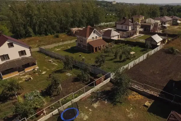 Photo of new house, the roof of which is made of metal. Cottage in the co