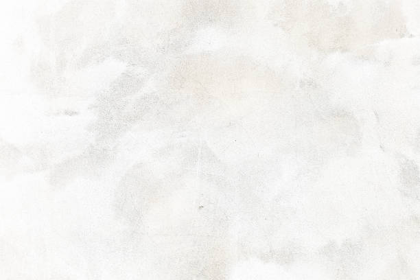 Abstract weathered texture stained old stucco light gray and aged paint white brick wall background in rural room.
