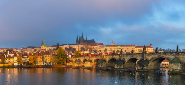 Charles Bridge is a historic bridge that crosses the Vltava river in Prague, Czech Republic.