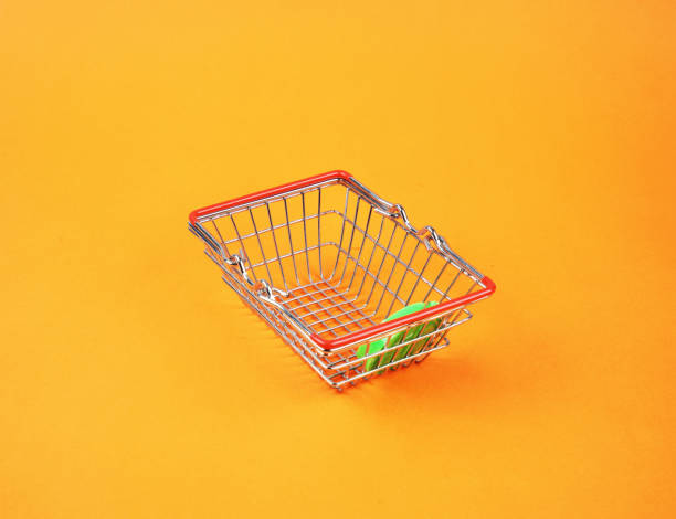 Shopping cart on orange background