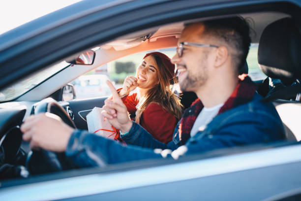 istock Couple driving in car 1190449340