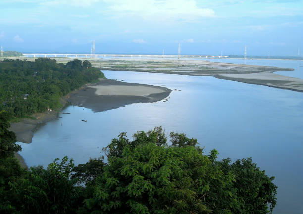 Kolia Bhomora Setu is a pre-stressed concrete road bridge over the Brahmaputra River near Tezpur and Kaliabor in Assam, India. It is named after the Ahom General Kolia Bhomora Phukan. Kolia Bhomora Setu is a pre-stressed concrete road bridge over the Brahmaputra River near Tezpur and Kaliabor in Assam, India. It is named after the Ahom General Kolia Bhomora Phukan. brahmaputra river stock pictures, royalty-free photos & images