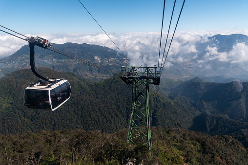 Sapa, Vietnam- November 17, 2019 : A white Cable car is carrying the passengers go to the Fansipan mountain of the Sapa.