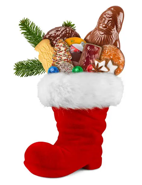 Red st nicholas day boot filled with chocolate santa claus cookies gingerbread cinnamon stars orange and green fresh fir branches isolated on white background
