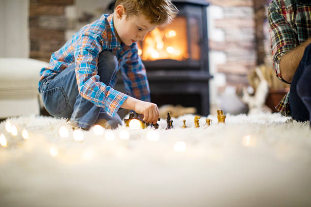 istock Father and son enjoying Christmas holidays at home 1190457059