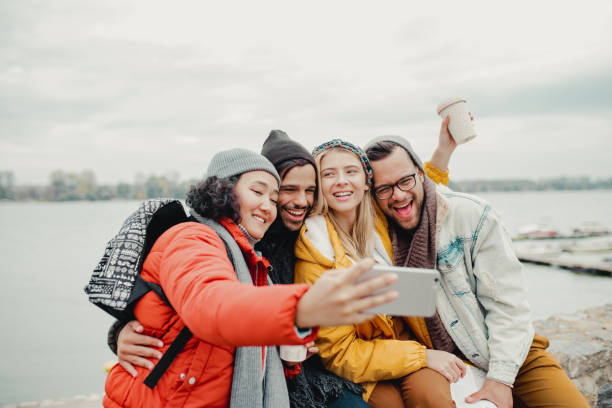 istock Group of friends taking a selfie by the river 1190457373