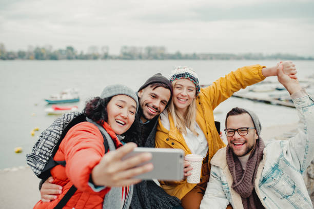 istock Group of friends taking a selfie by the river 1190457404