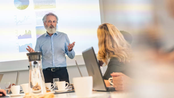istock Mature businessman giving a presentation 1190457463