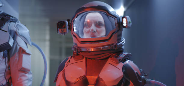 istock Female astronaut standing in corridor 1190458678