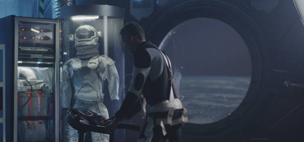 istock Astronaut exercising in a space station 1190458693