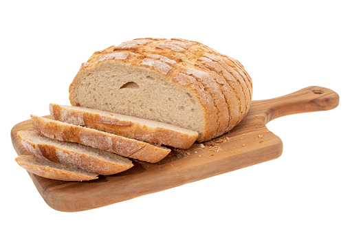 Sliced sourdough bread on a cutting board - white background