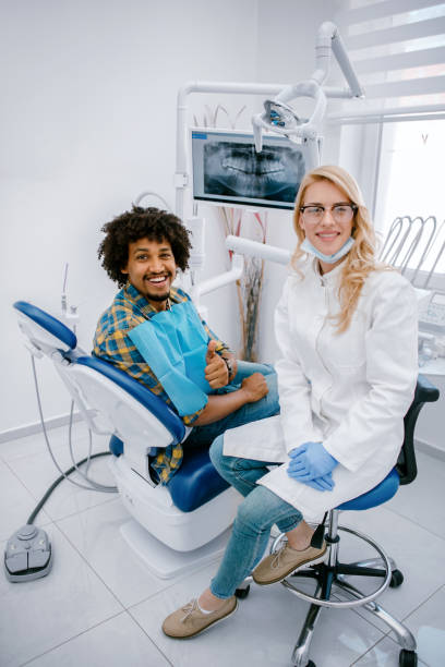 istock Man giving thumbs up at dentist office 1190462467