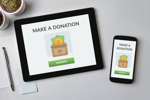 Donate concept on tablet and smartphone screen stock photo