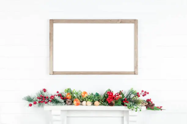 Horizontal wooden frame mockup - empty frame on a white wall with bright leaves