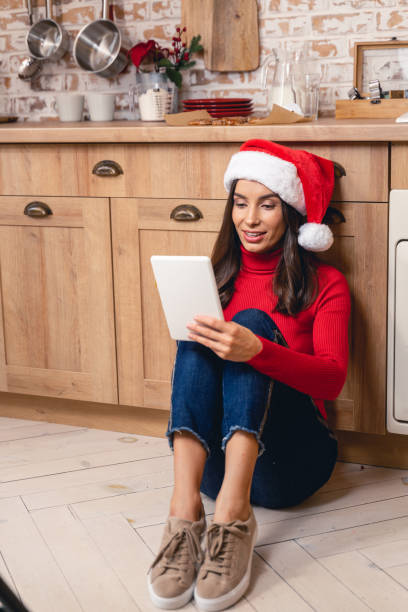 istock Pretty woman checking email on her tablet 1190466333
