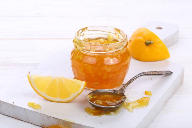 istock Tangerine jam on white wooden background 1190468264
