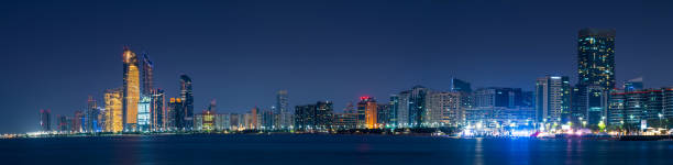 Abu Dhabi downtown night skyline full panoramic view at blue hour