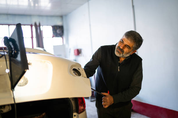 istock Unpainted car dent correction process, Bodywork dent correction, hail, door dent 1190473661
