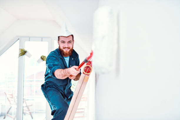 istock Happy Male Painting His Home Interior 1190474092