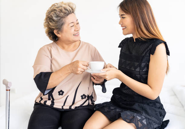 istock caregiver prepare coffee for patient 1190474097