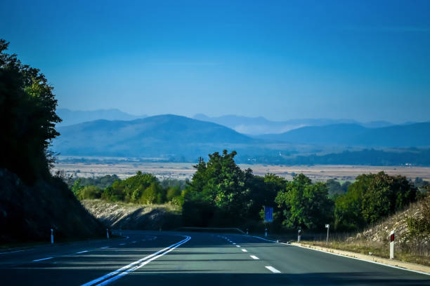 Empty two way road with landscape of Gorski Kotar in Croatia.