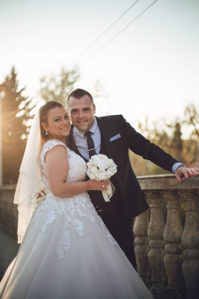 istock Newlyweds enjoy the sunset 1190480006