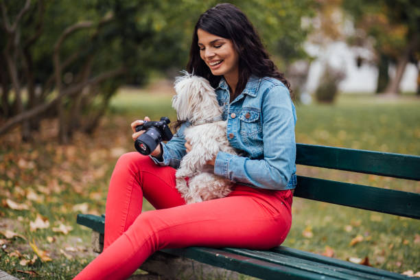 Cheerful lady holding a cemera