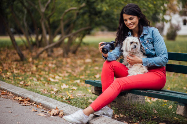 istock Smiling woman looking at photo camera 1190483738