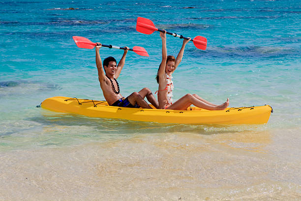 istock young couple kayaking in hawaii 119048697