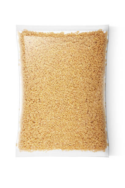 Wheat in transparent plastic bag isolated on white