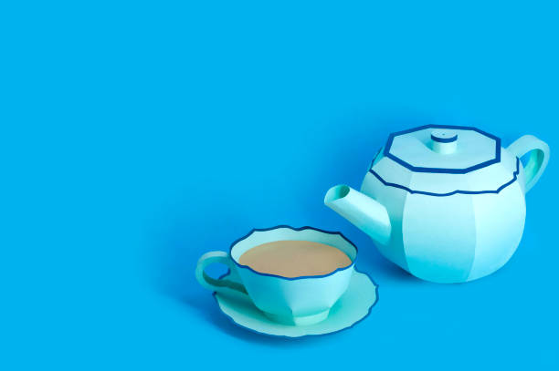 istock Paper teapot and cup with tea 1190495790